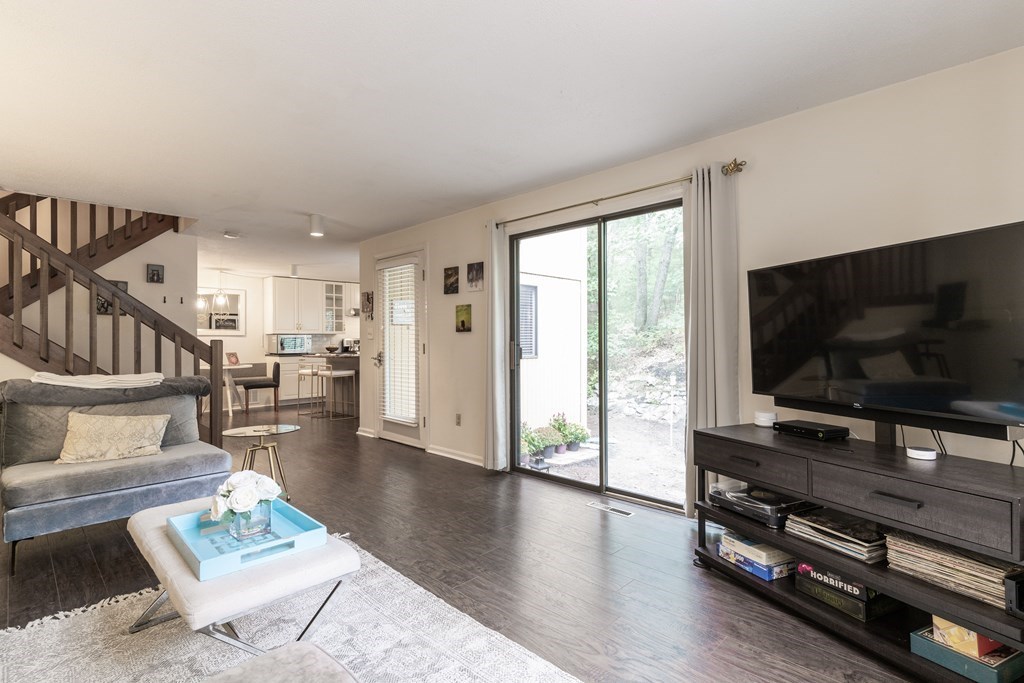 46 Mountain Gate Road, Unit 46 Ashland, MA 01721 - Photo 4 of 14 a living room with furniture and a flat screen tv