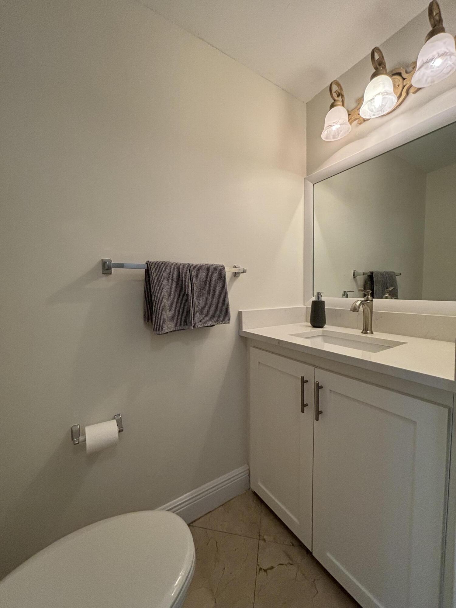 830 Jeffery Street, Unit 830 Boca Raton, FL 33487 - Photo 13 of 28 New half bath/quartz counter