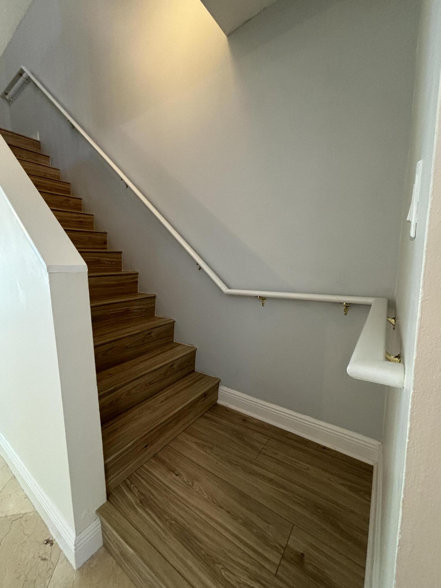 830 Jeffery Street, Unit 830 Boca Raton, FL 33487 - Photo 14 of 28 Staircase to 2nd level