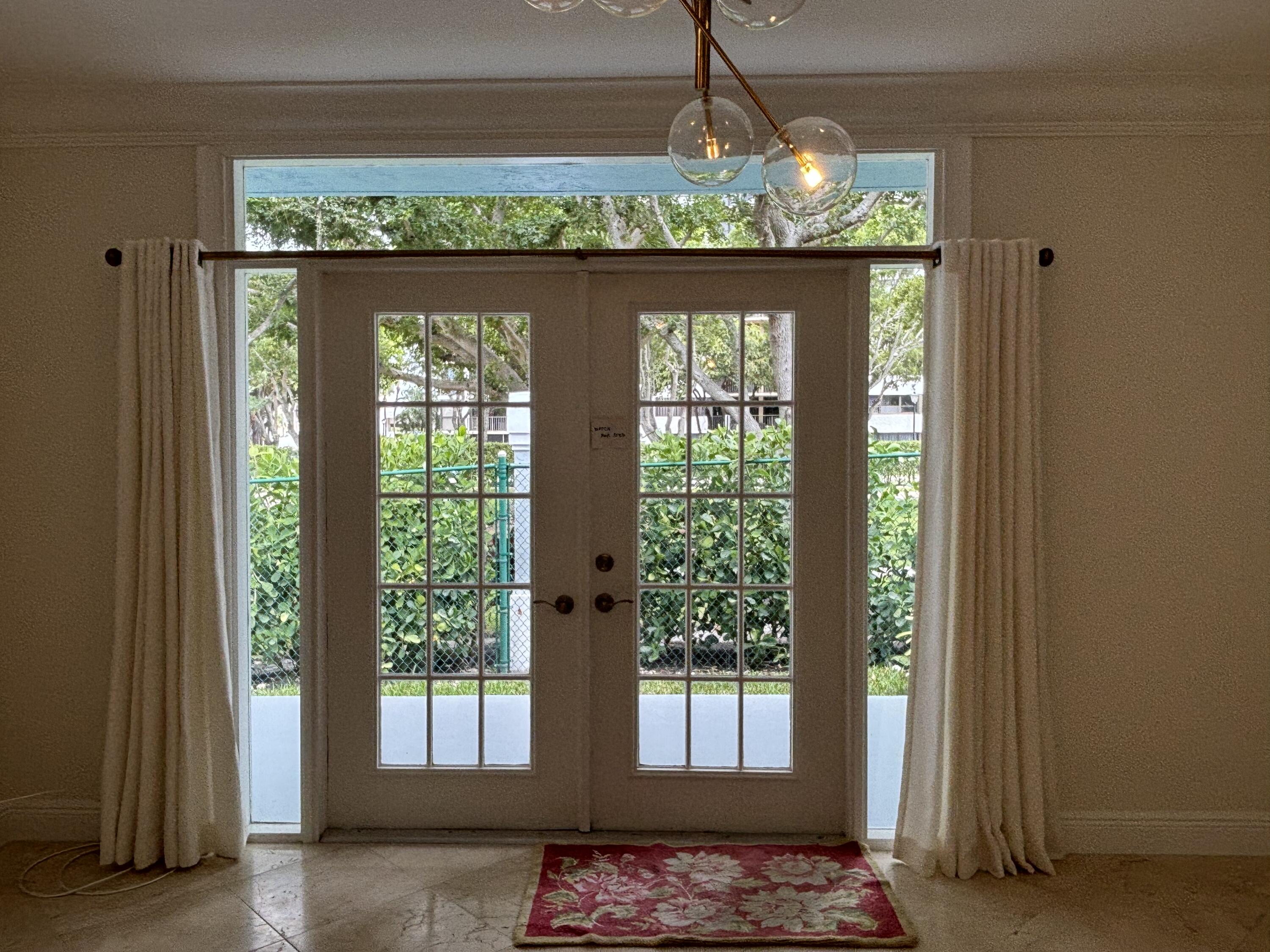830 Jeffery Street, Unit 830 Boca Raton, FL 33487 - Photo 8 of 28 French doors leading out to patio