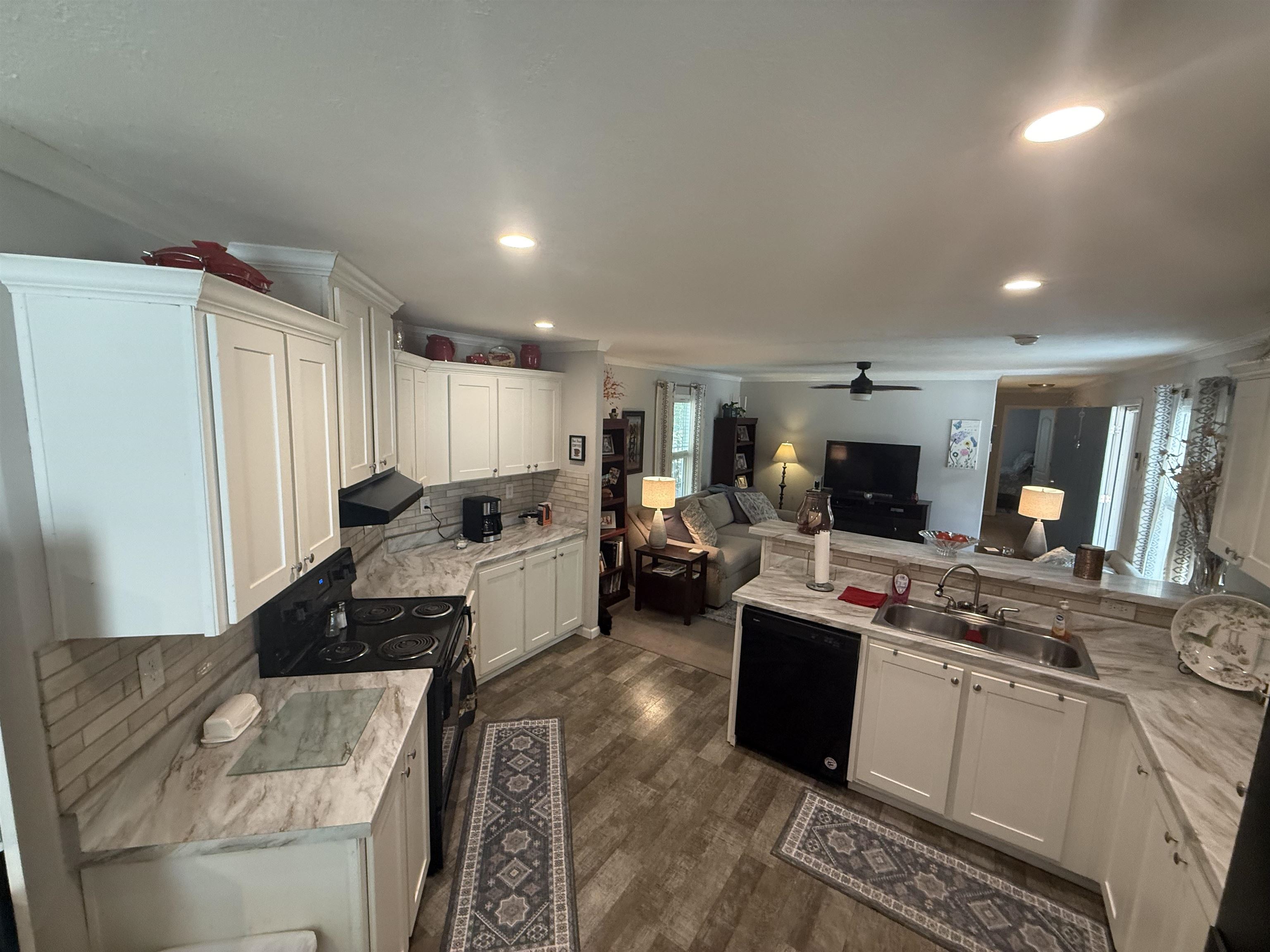 185 Pine Tree Road Moscow, TN 38057 - Photo 12 of 36 Kitchen with white cabinetry, wood-finish flooring, recessed lighting, and a dual basin sink