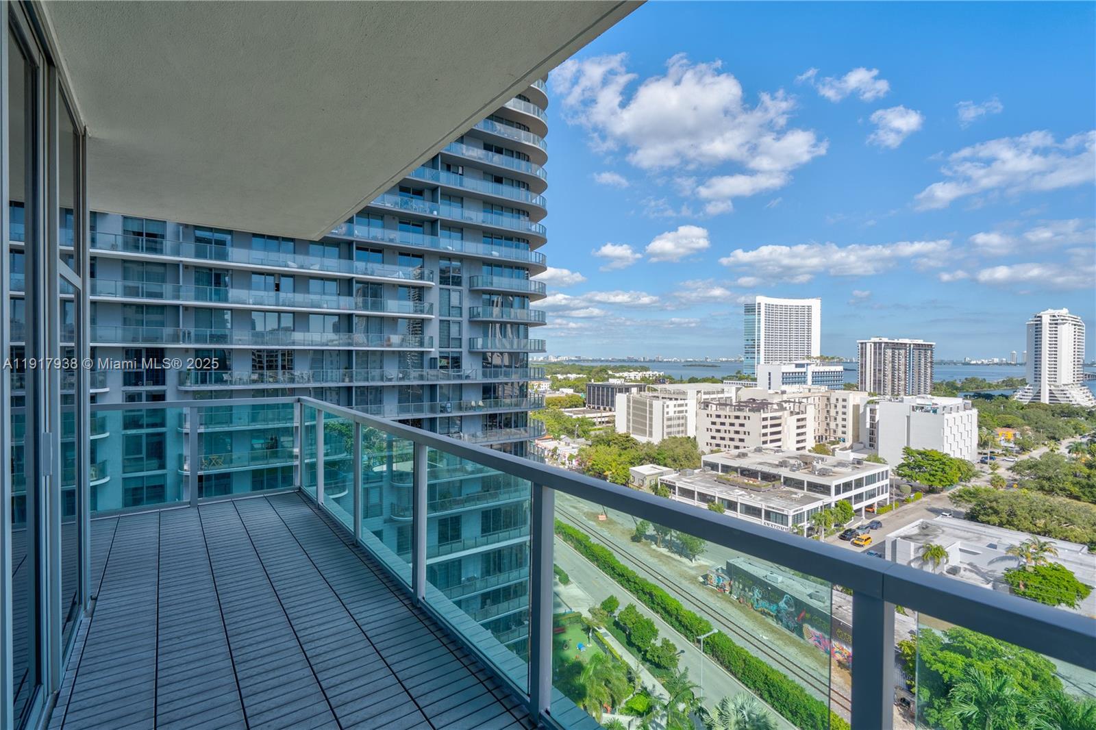 3301 Northeast 1st Avenue, Unit H1215 Miami, FL 33137 - Photo 13 of 45 a view of a balcony with wooden floor and city view