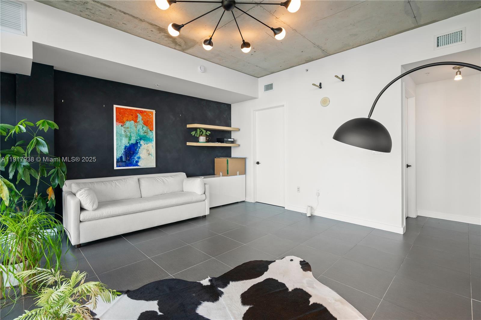 3301 Northeast 1st Avenue, Unit H1215 Miami, FL 33137 - Photo 17 of 45 a living room with furniture and a large window