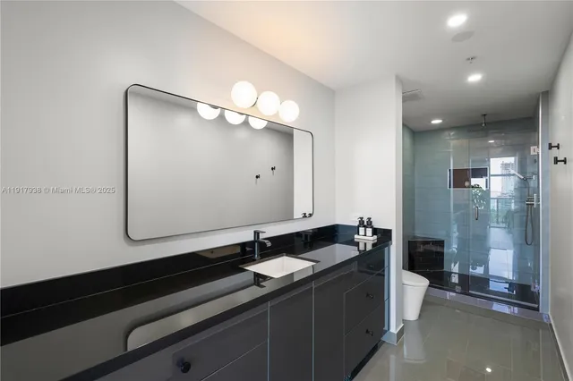 a bathroom with a double vanity sink and mirror