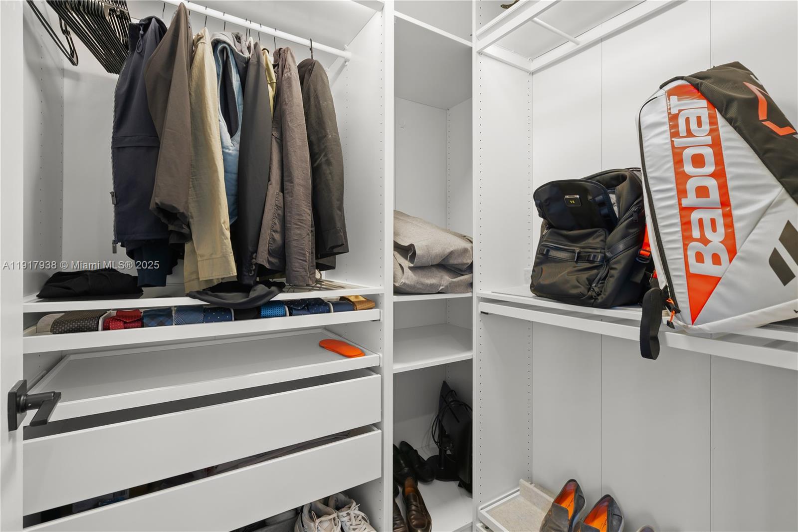 3301 Northeast 1st Avenue, Unit H1215 Miami, FL 33137 - Photo 23 of 45 a view of walk in closet with clothes and shoes