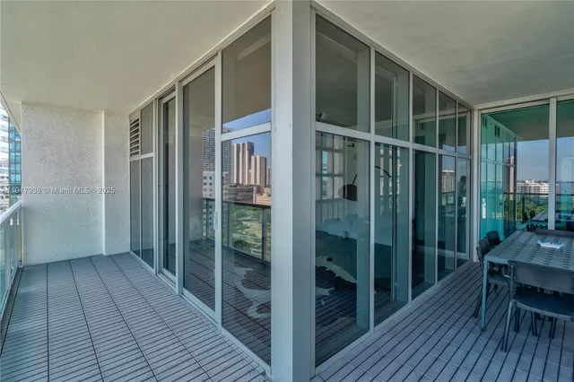 a view of a balcony with wooden floor