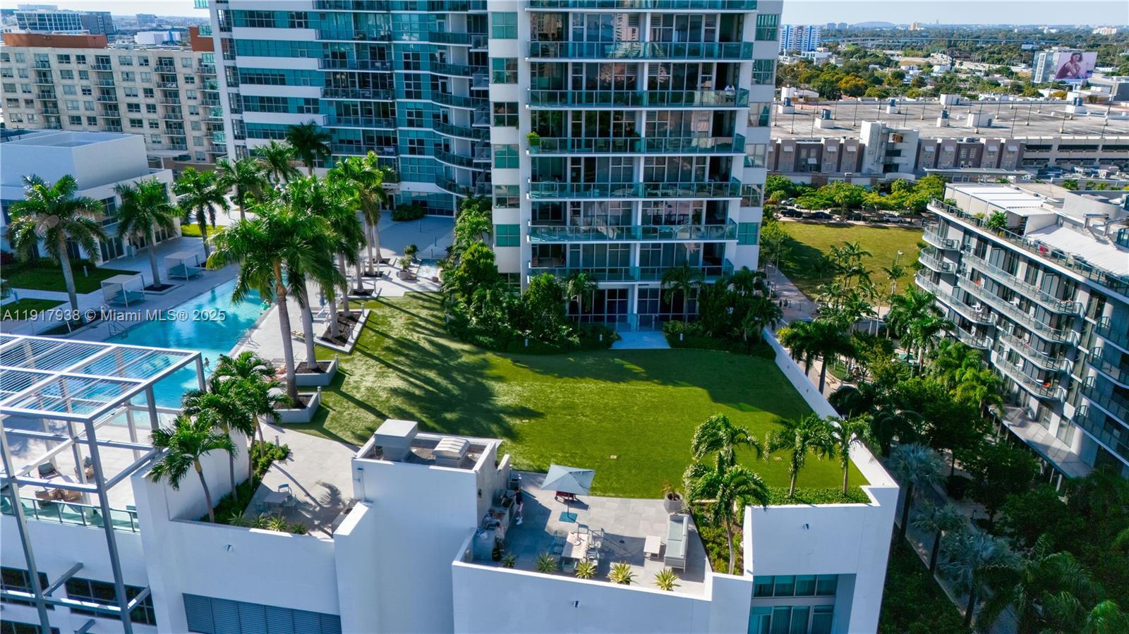 3301 Northeast 1st Avenue, Unit H1215 Miami, FL 33137 - Photo 37 of 45 a view of a flower garden with a building in the background