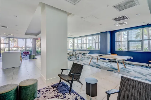 a living room with lots of furniture and a table