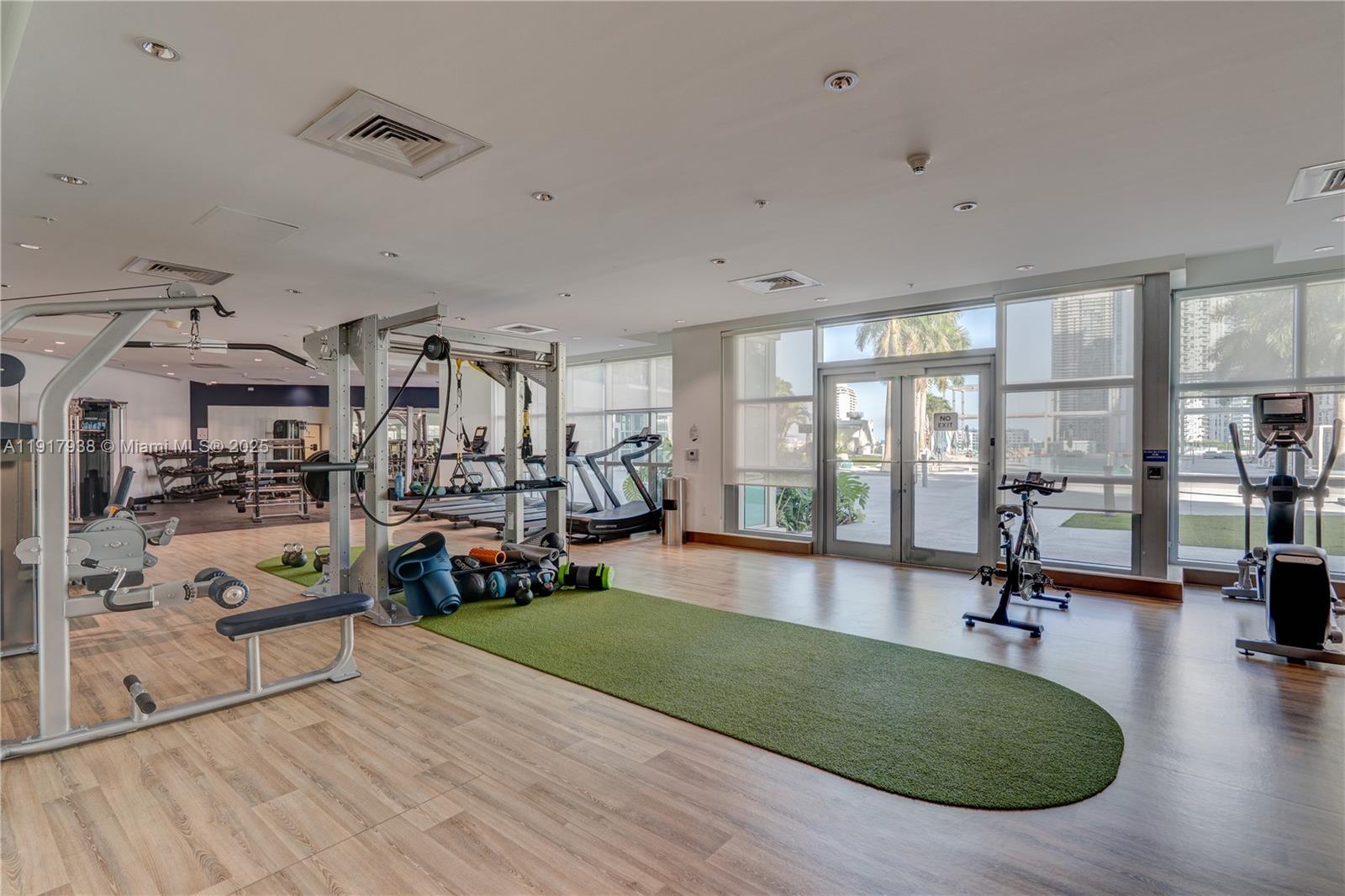 3301 Northeast 1st Avenue, Unit H1215 Miami, FL 33137 - Photo 44 of 45 a living room with lots of furniture and a table
