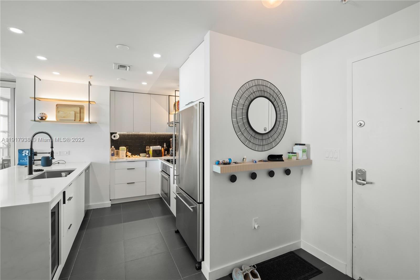 3301 Northeast 1st Avenue, Unit H1215 Miami, FL 33137 - Photo 8 of 45 a kitchen with cabinets and window