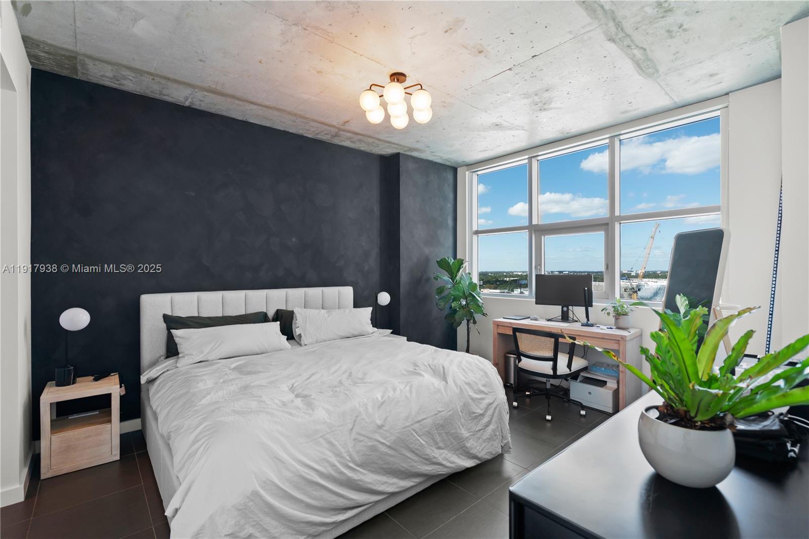 3301 Northeast 1st Avenue, Unit H1215 Miami, FL 33137 - Photo 9 of 45 a bedroom with a large bed and a potted plant