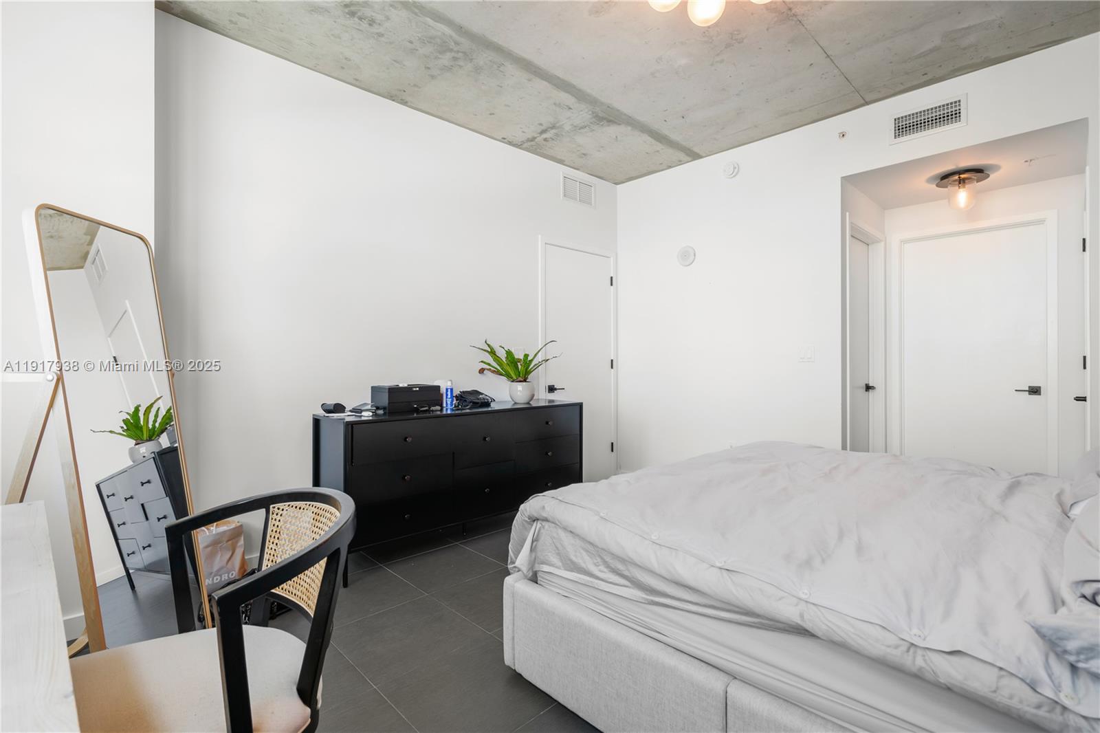 3301 Northeast 1st Avenue, Unit H1215 Miami, FL 33137 - Photo 10 of 45 a bedroom with a bed chair and window