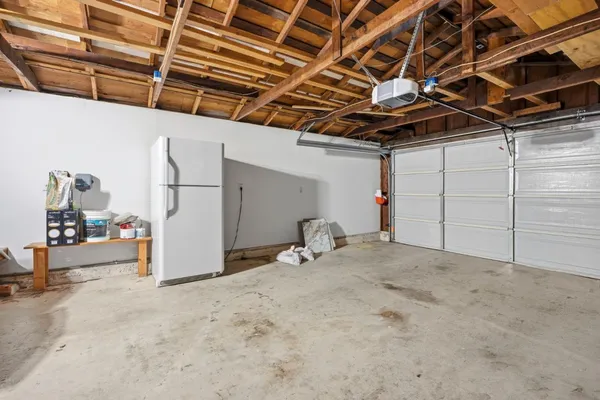 a bathroom with a sink a mirror a toilet and bathtub