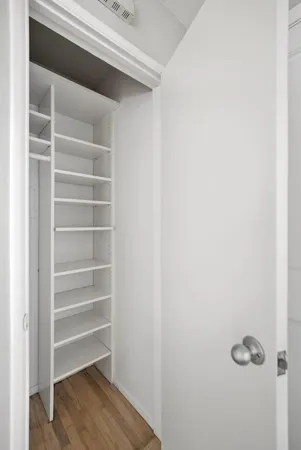 a view of a backyard with wooden fence