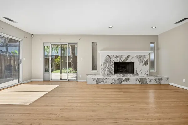a view of living room with furniture and fireplace