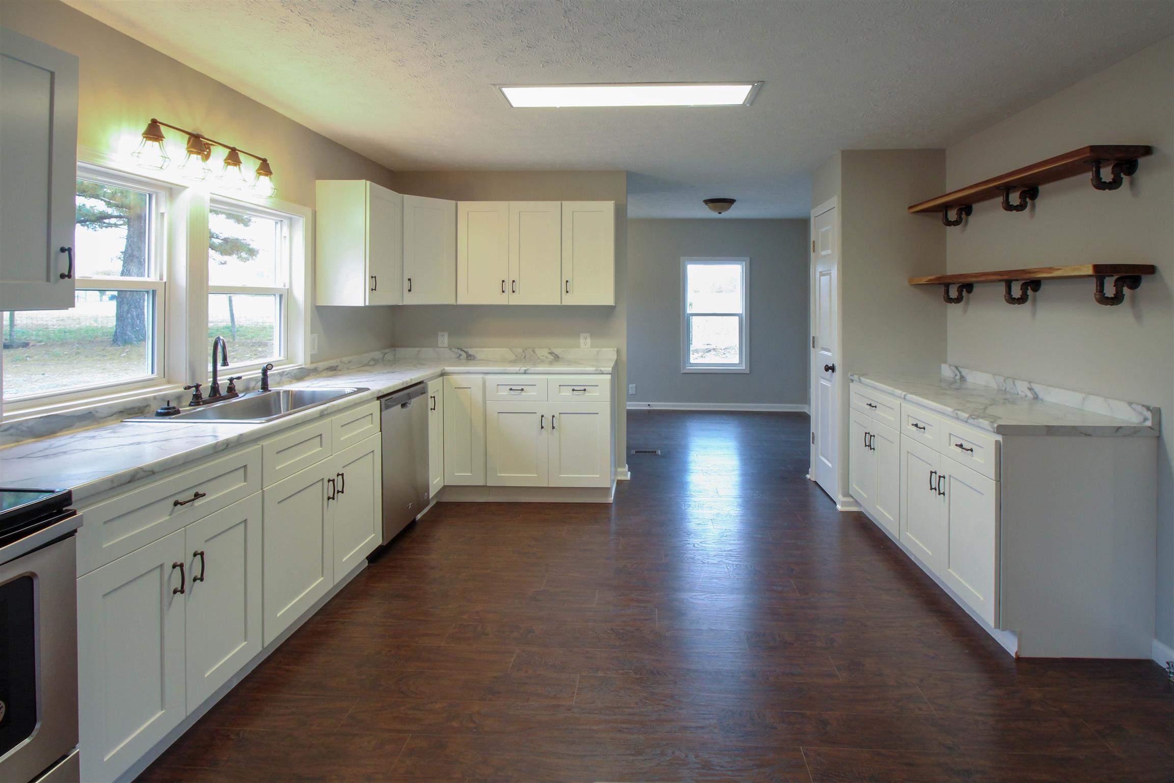 5647 Hopewell Road Springfield, TN 37172 - Photo 2 of 12 a large white kitchen with a large window