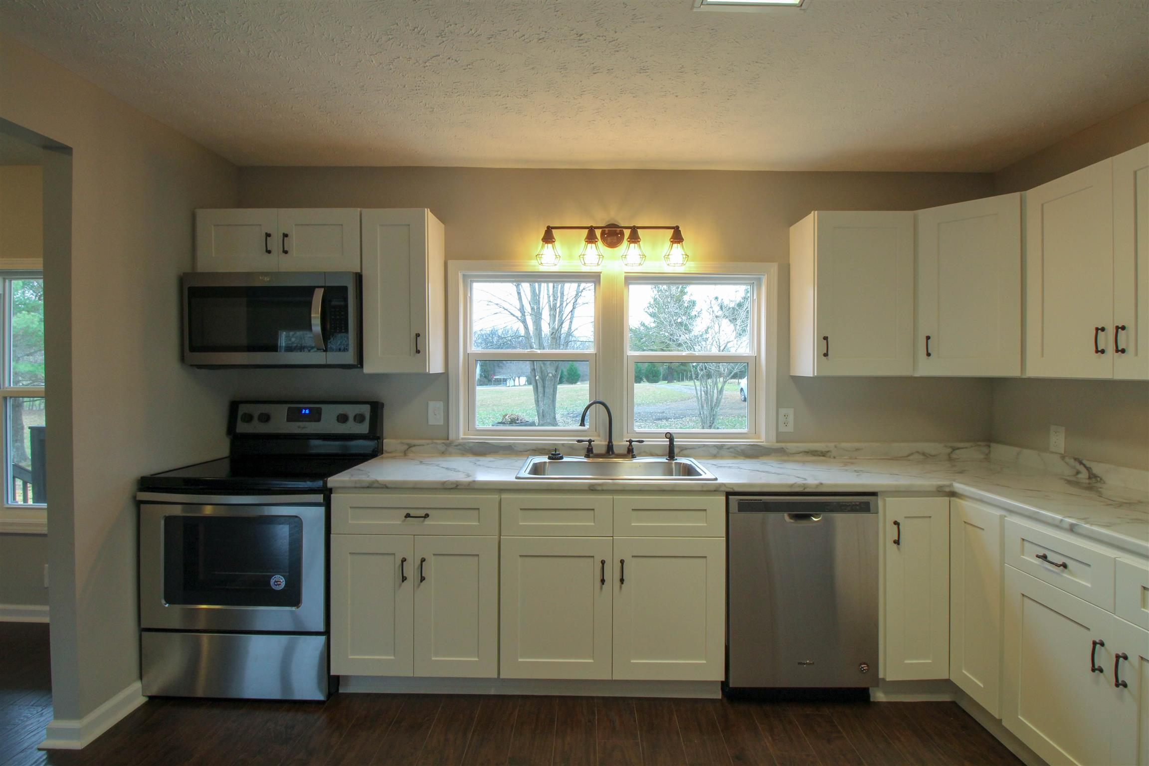 5647 Hopewell Road Springfield, TN 37172 - Photo 3 of 12 a kitchen with a sink stove and microwave