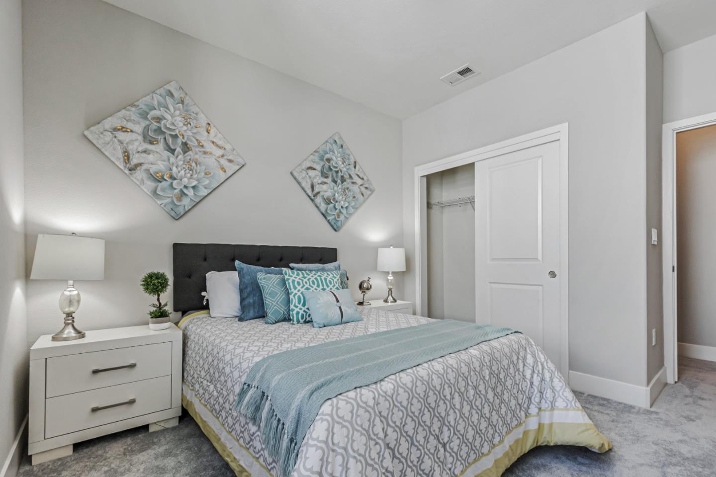 1633 Centre Pointe Drive Milpitas, CA 95035 - Photo 18 of 38 a bedroom with a large bed and a chandelier