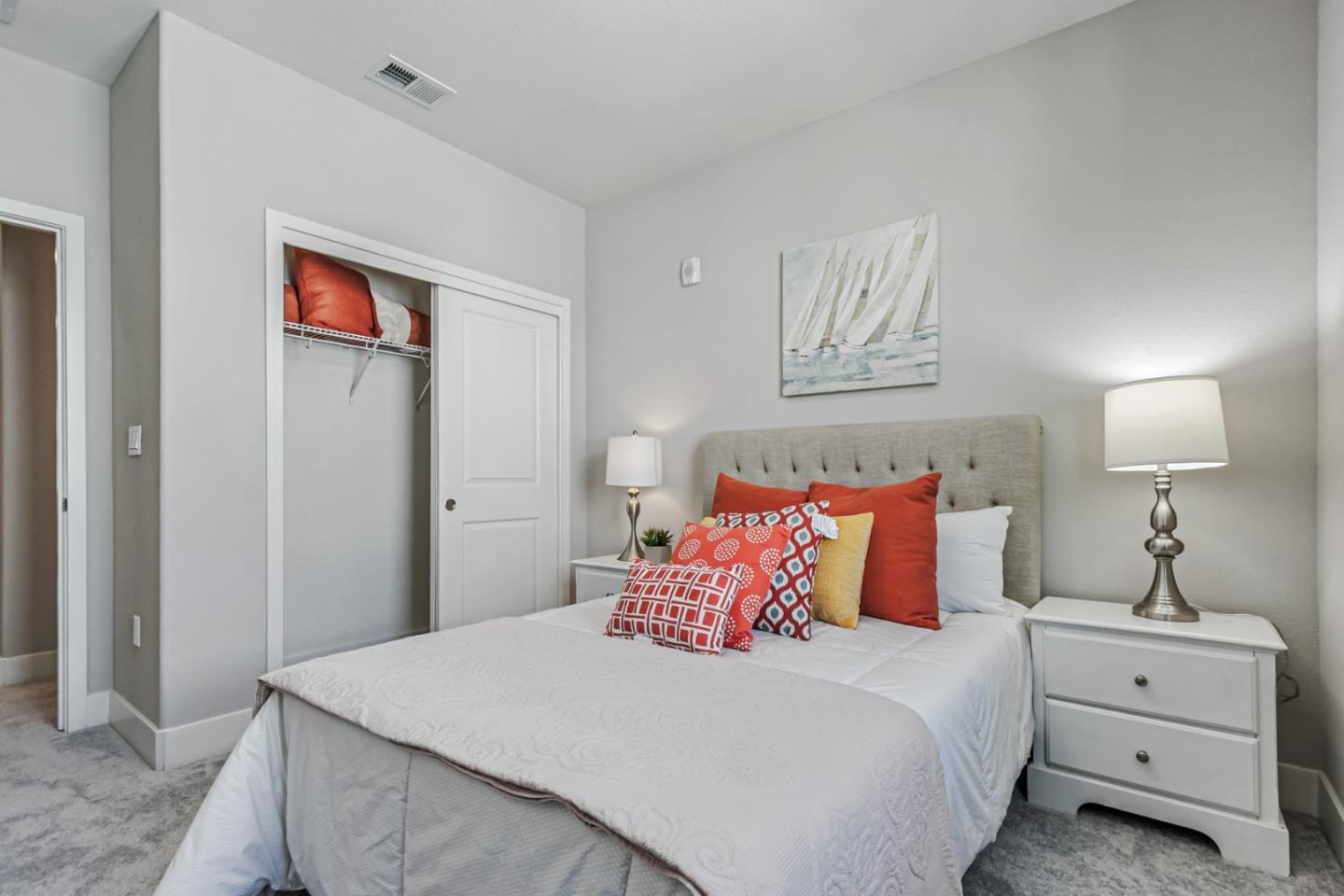 1633 Centre Pointe Drive Milpitas, CA 95035 - Photo 20 of 38 a bedroom with a bed and a lamp on dresser