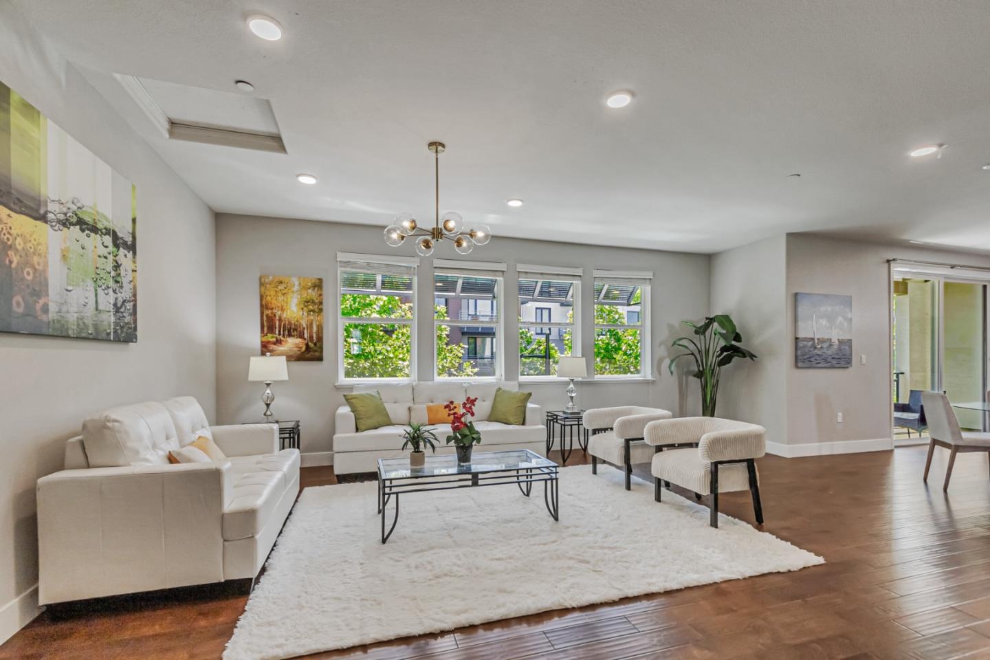 1633 Centre Pointe Drive Milpitas, CA 95035 - Photo 2 of 38 a living room with furniture and a chandelier
