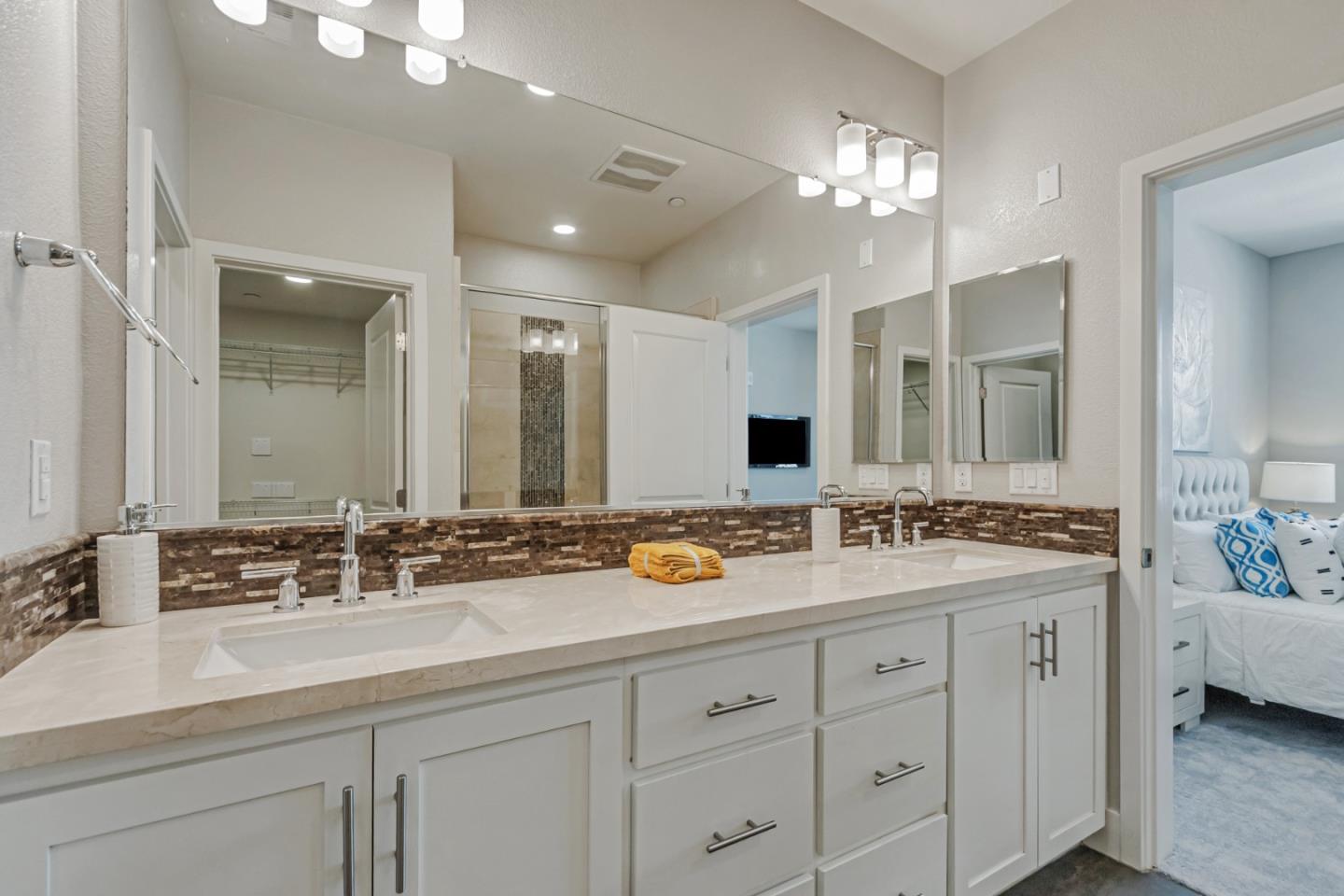 1633 Centre Pointe Drive Milpitas, CA 95035 - Photo 22 of 38 a bathroom with a double vanity sink and a mirror