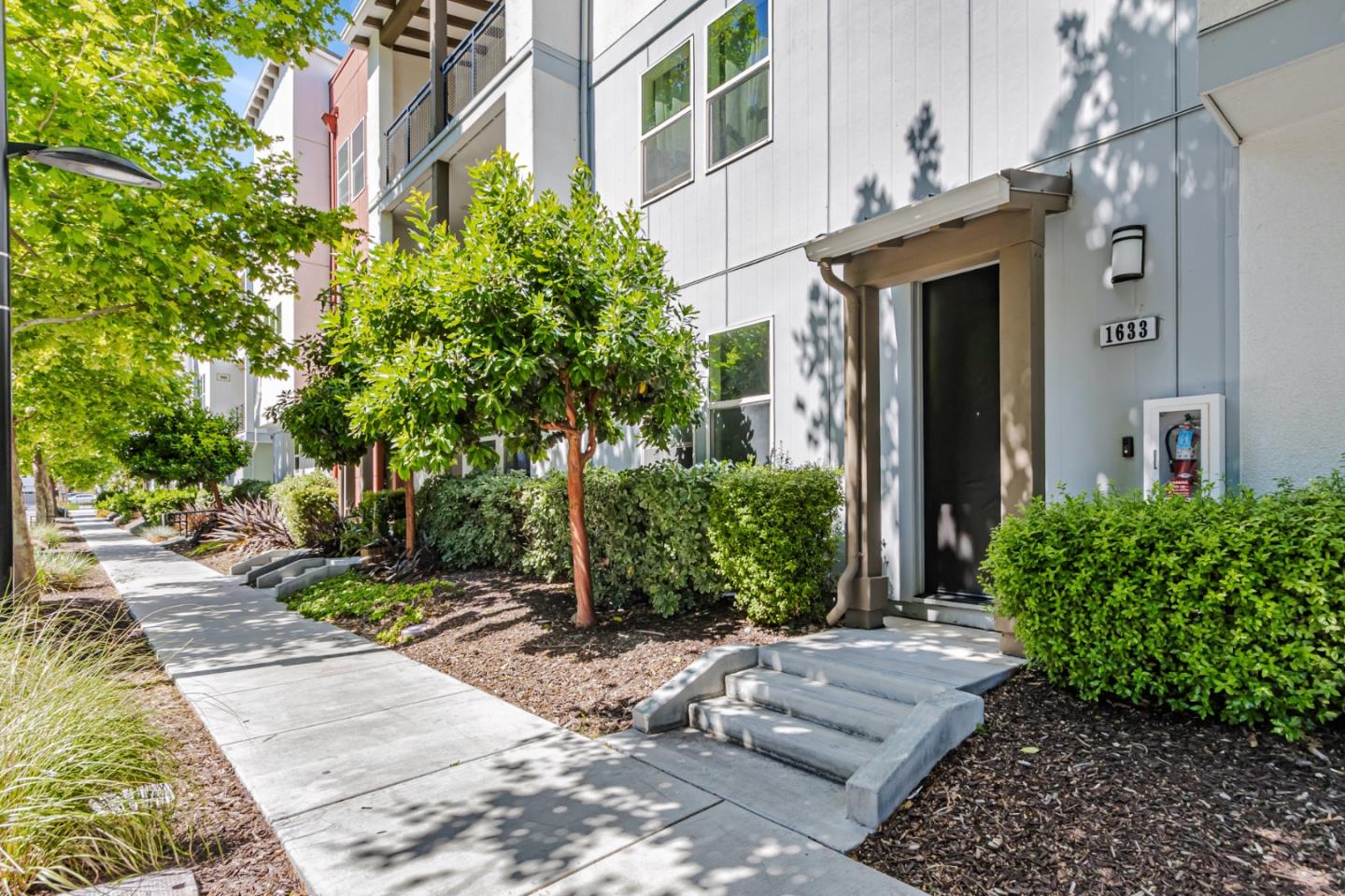 1633 Centre Pointe Drive Milpitas, CA 95035 - Photo 3 of 38 a view of a house with a yard