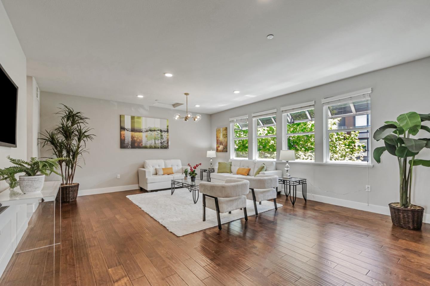 1633 Centre Pointe Drive Milpitas, CA 95035 - Photo 6 of 38 a living room with furniture and a potted plant