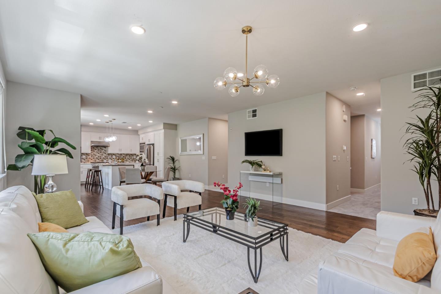 1633 Centre Pointe Drive Milpitas, CA 95035 - Photo 7 of 38 a living room with furniture and a flat screen tv