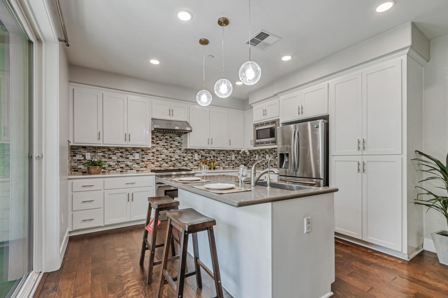 1633 Centre Pointe Drive Milpitas, CA 95035 - Photo 9 of 38 a kitchen with stainless steel appliances granite countertop a sink a stove and refrigerator