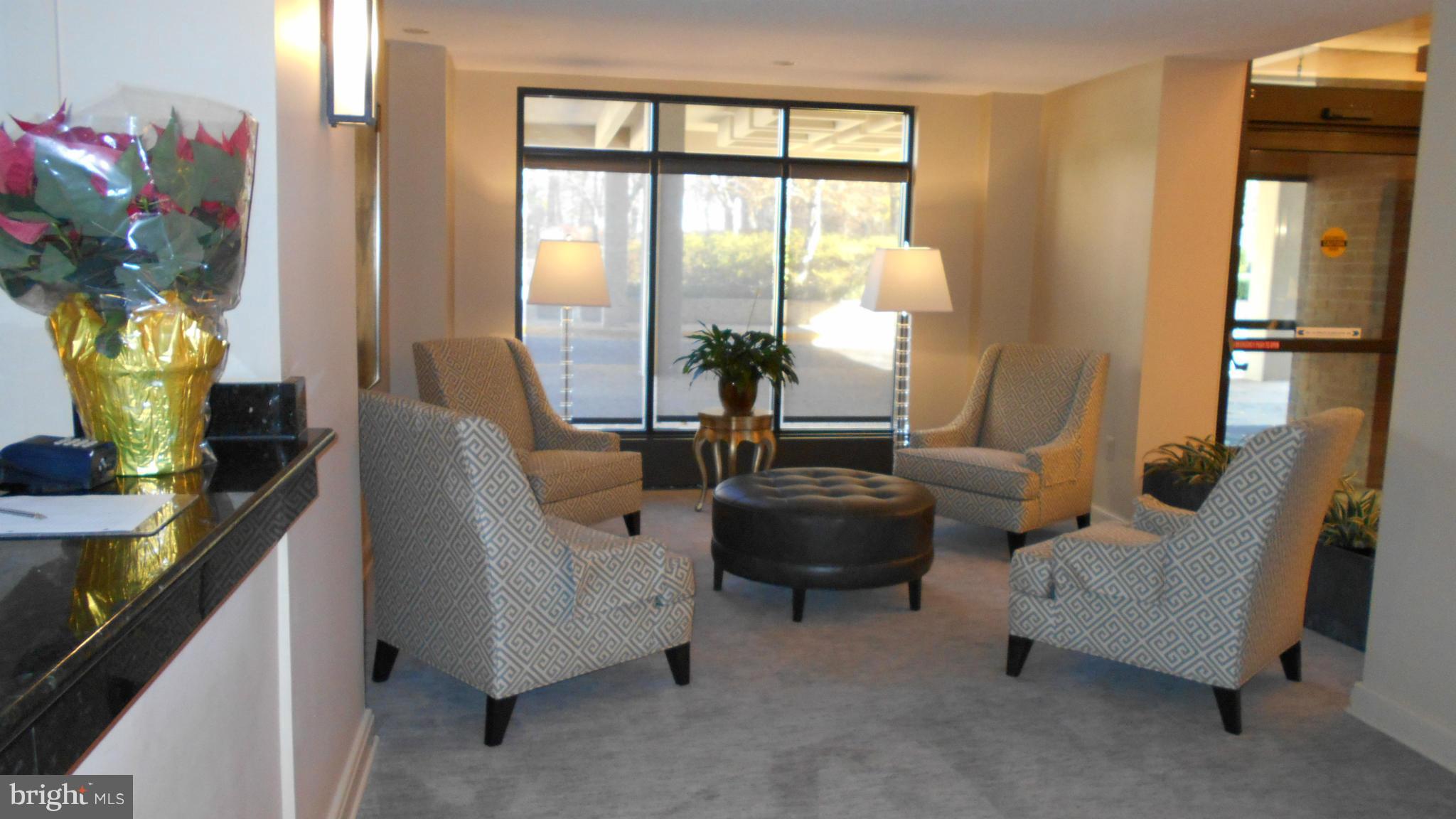 1808 Old Meadow Road, Unit 1003 McLean, VA 22102 - Photo 17 of 22 a living room with furniture and a large window