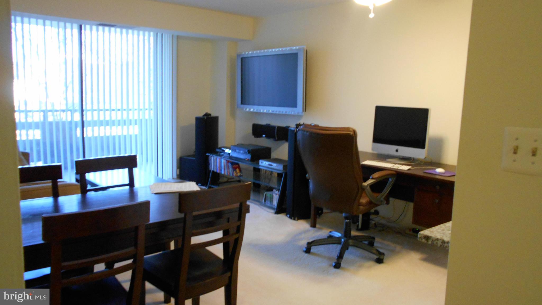 1808 Old Meadow Road, Unit 1003 McLean, VA 22102 - Photo 3 of 22 a view of a workspace with furniture and a window