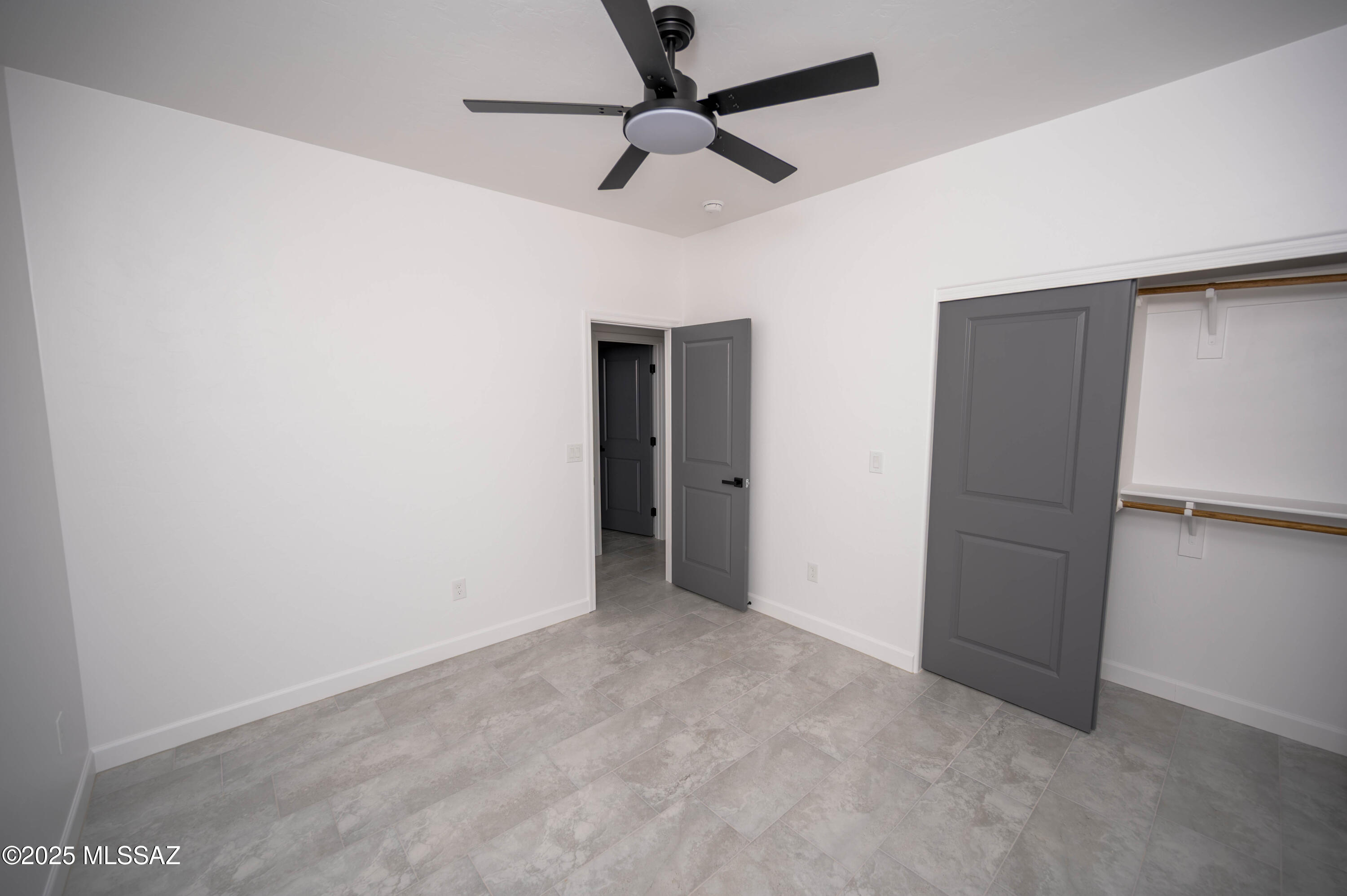 1781 Elder Court Rio Rico, AZ 85648 - Photo 13 of 50 an empty room with closet and a ceiling fan