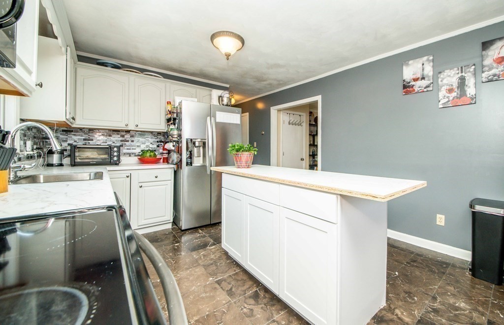 22 Michael Street, Unit 22 Fall River, MA 02721 - Photo 11 of 28 a kitchen with a sink appliances and cabinets