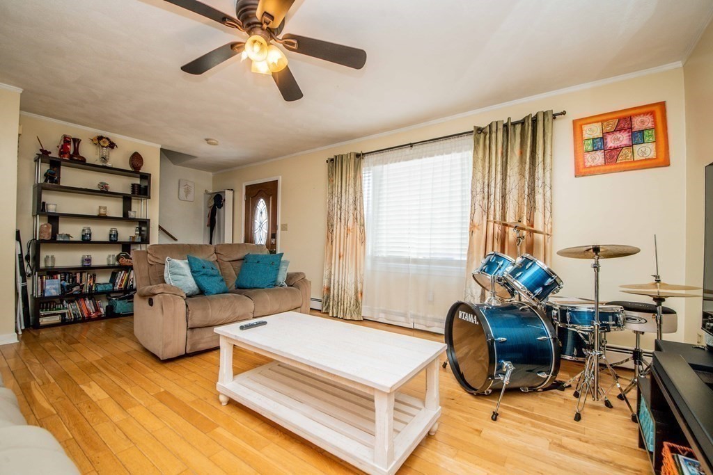 22 Michael Street, Unit 22 Fall River, MA 02721 - Photo 15 of 28 a bedroom with furniture and a chandelier