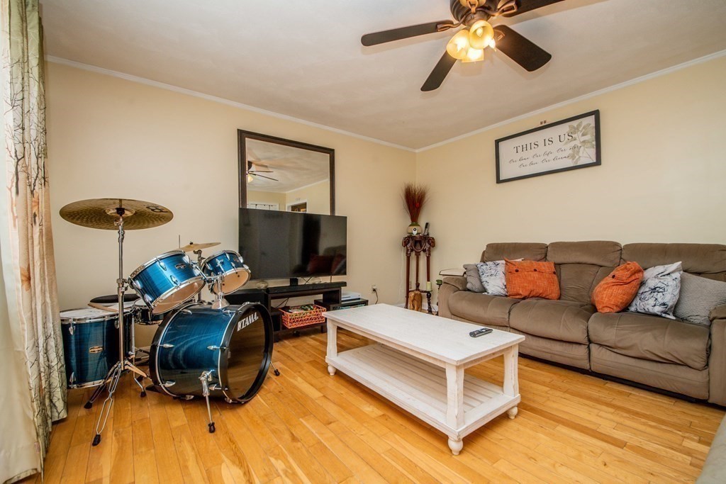 22 Michael Street, Unit 22 Fall River, MA 02721 - Photo 16 of 28 a living room with furniture and a flat screen tv