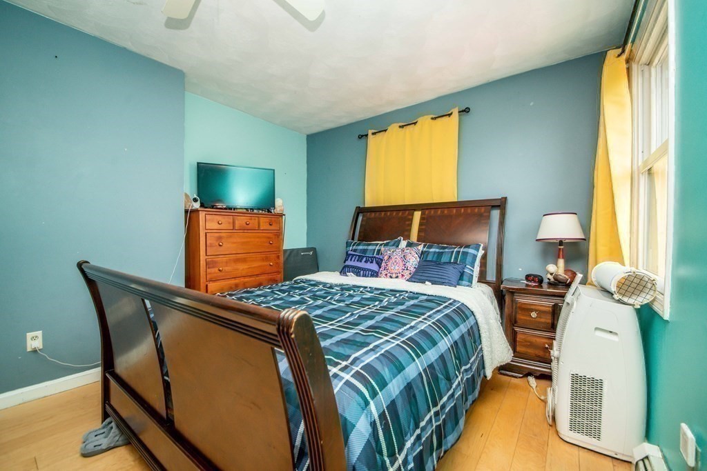 22 Michael Street, Unit 22 Fall River, MA 02721 - Photo 20 of 28 a bedroom with a bed and a tv
