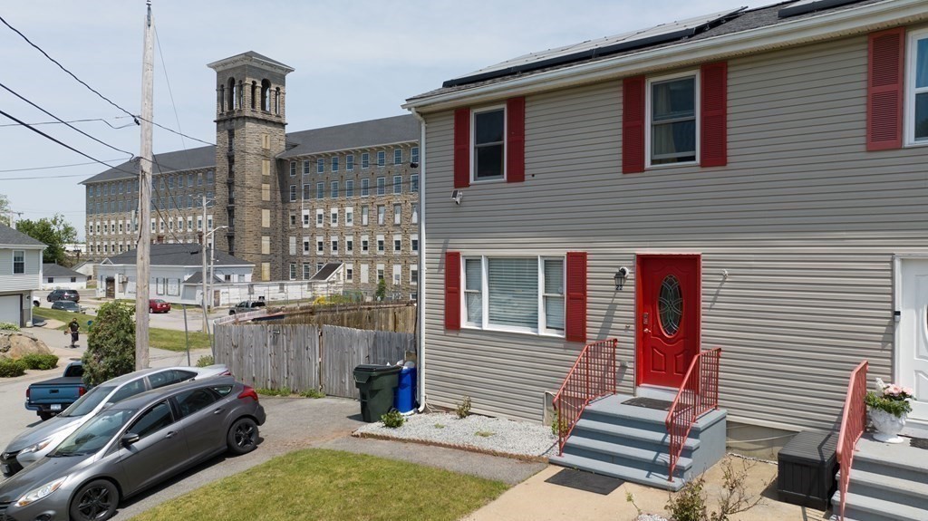 22 Michael Street, Unit 22 Fall River, MA 02721 - Photo 3 of 28 a backyard of a house with barbeque oven table and chairs