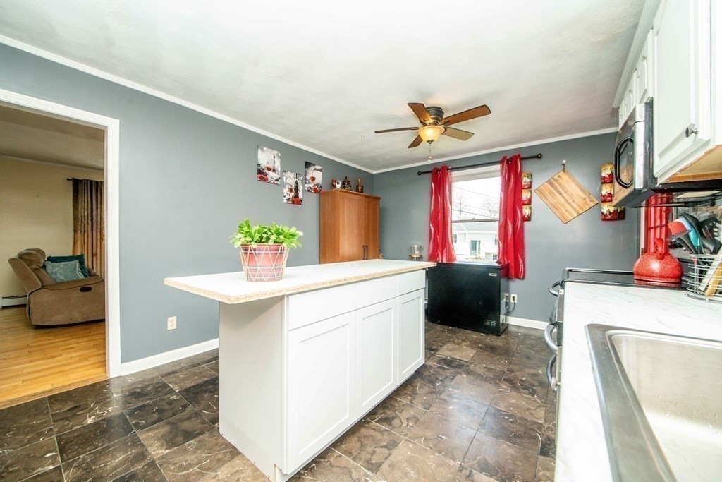 22 Michael Street, Unit 22 Fall River, MA 02721 - Photo 10 of 28 a kitchen with a sink stove and a refrigerator