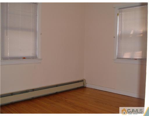 216 New Dover Road, Unit 216 Colonia, NJ 07067 - Photo 5 of 10 a view of an empty room