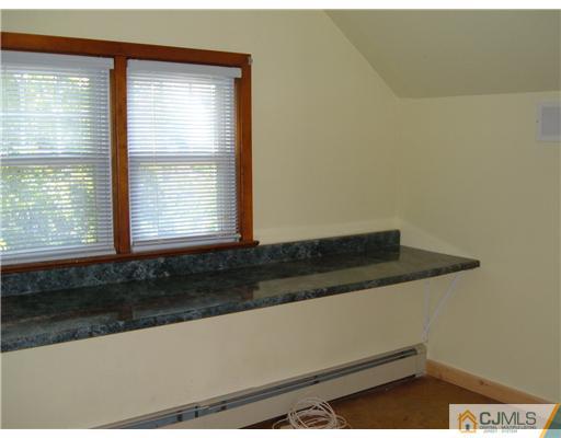 216 New Dover Road, Unit 216 Colonia, NJ 07067 - Photo 8 of 10 a view of a window in a room