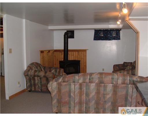 216 New Dover Road, Unit 216 Colonia, NJ 07067 - Photo 9 of 10 a bedroom with a bed and a painting on the wall