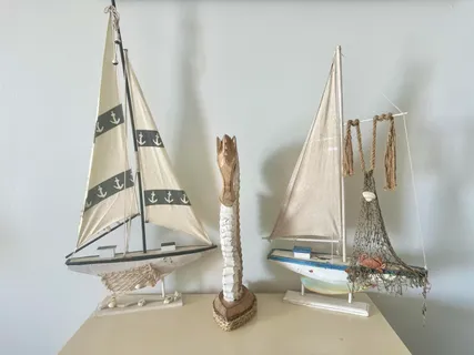 a kitchen with stainless steel appliances kitchen island granite countertop a refrigerator a stove a microwave oven with white cabinets and wooden floor