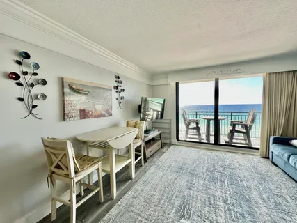 a dining room with a table and chairs
