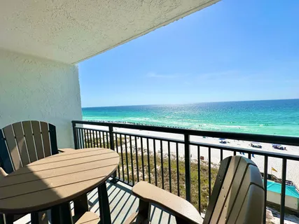a view of a balcony with wooden floor