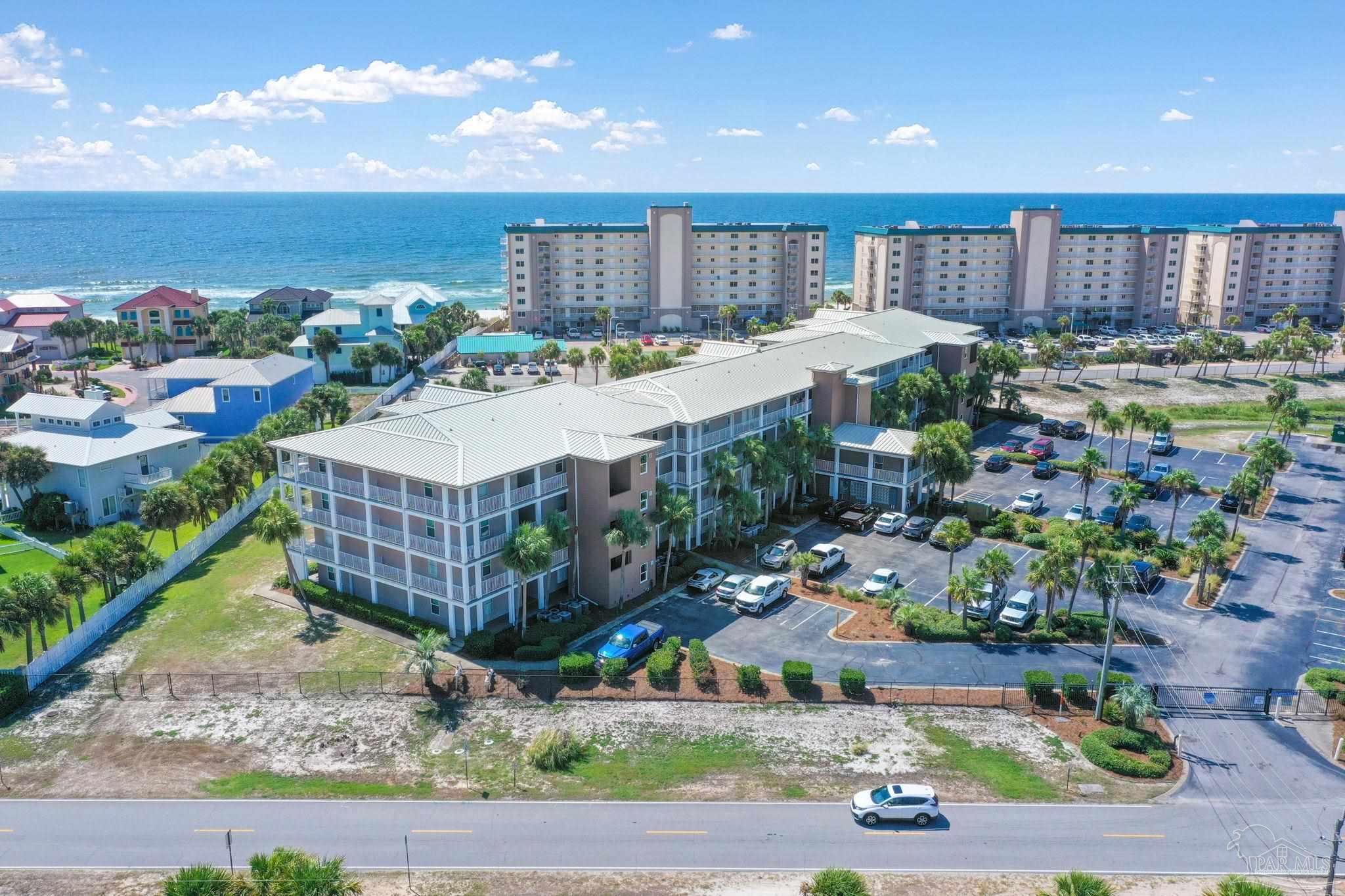 13351 Johnson Beach Road, Unit 203E Perdido Key, FL 32507 - Photo 54 of 55 a large building with a lots of plants in it