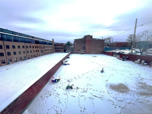 a view of balcony with wooden floor
