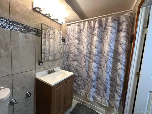 a bathroom with a sink and vanity