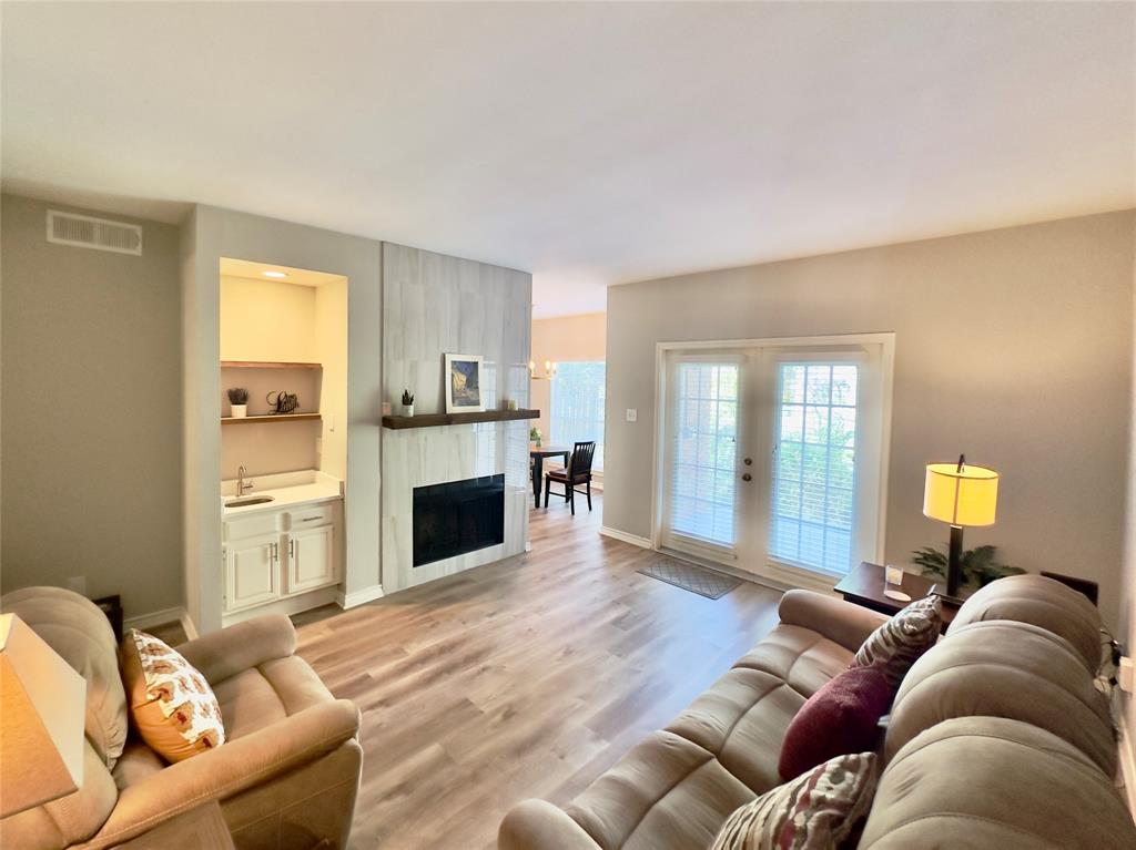 6315 Campbell Road, Unit 509 Dallas, TX 75248 - Photo 3 of 6 a living room with furniture and a fireplace