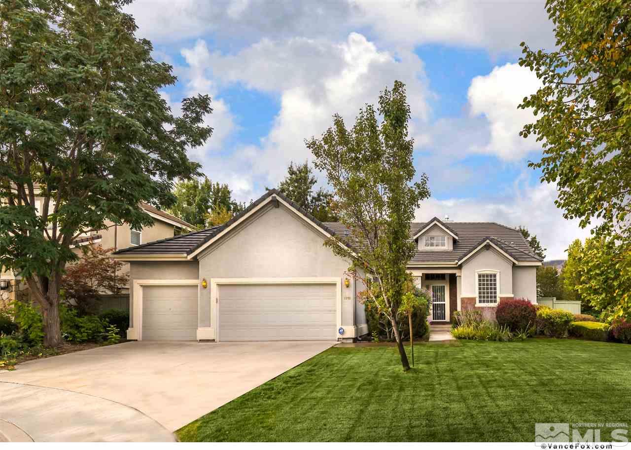 1898 Rombauer Court Reno, NV 89519 - Photo 1 of 6 a front view of a house with a yard and garage