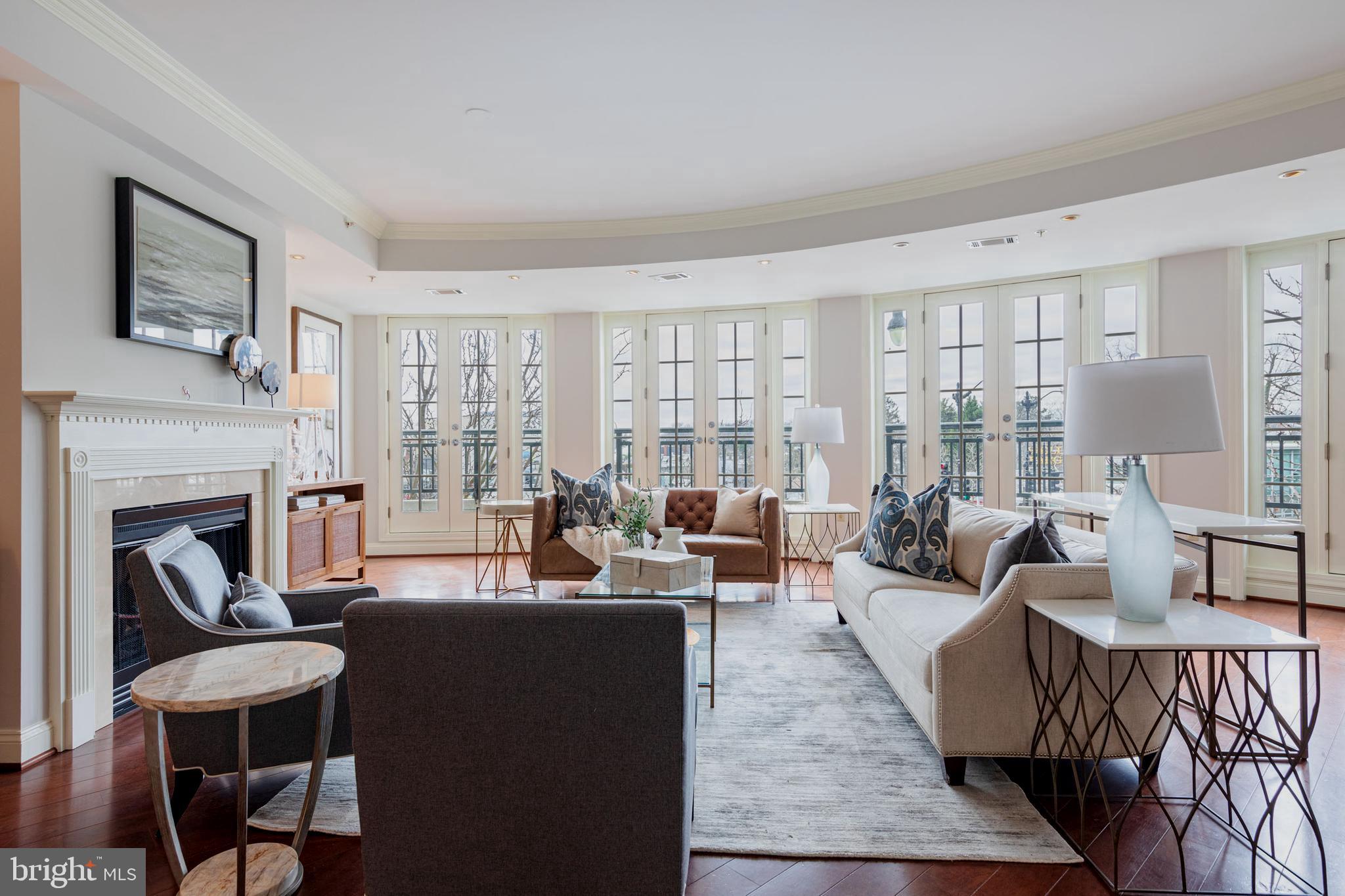 2501 Wisconsin Avenue Northwest, Unit 303 Washington, DC 20007 - Photo 3 of 24 Expansive Living Room w Fireplace SW exposure